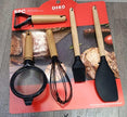 5-piece silicone dispensing set on a card