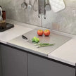 Stainless steel cutting board with edge