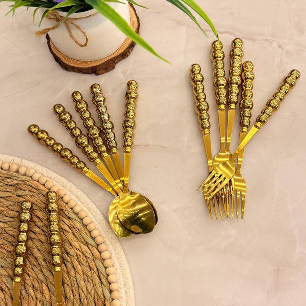 Bubbles 12-piece spoon and fork set with porcelain handles, gold color