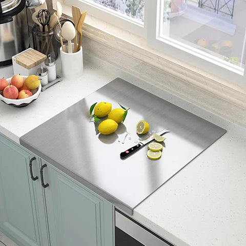 Stainless steel cutting board with edge